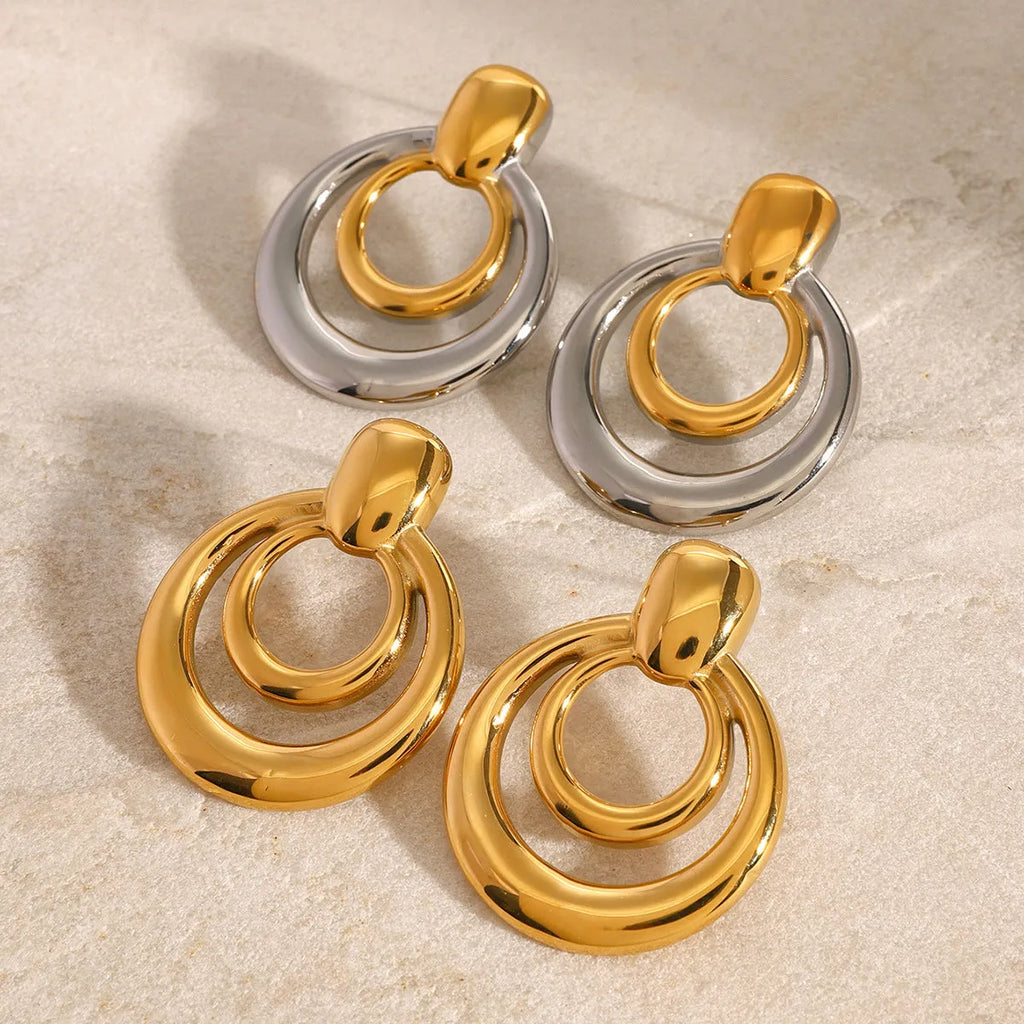 Round golden double-layer hollow stud earrings with geometric design and electroplated finish