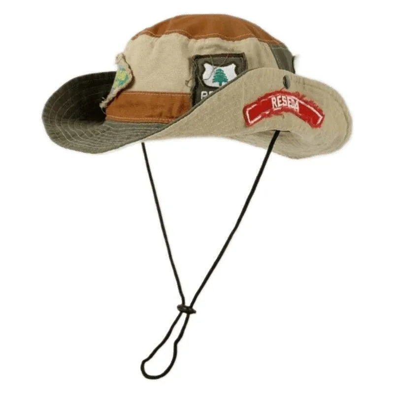 Army green cotton fisherman hat with flat crown and patchwork design folded for storage