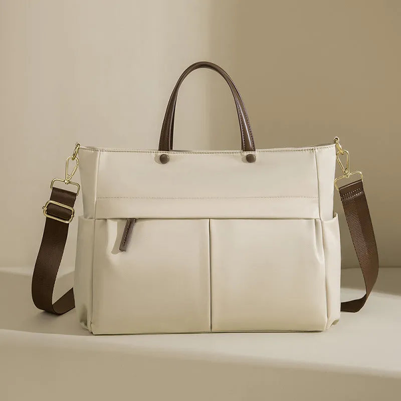 Women's Oxford cloth laptop bag in elegant black or nuts and apricots colours with contrast stitching