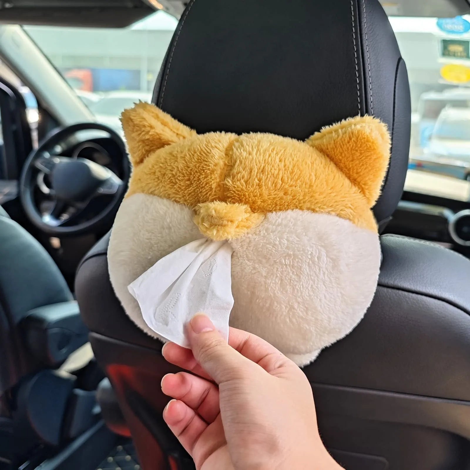 Yellow soft corgi butt shaped tissue box cover with elastic strap for car sun visor.