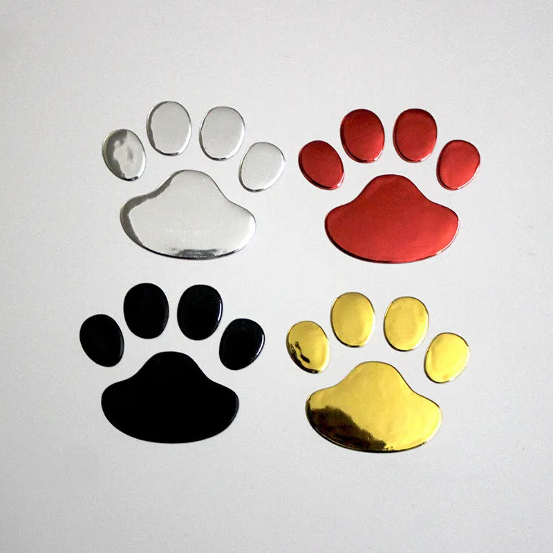 PVC car sticker with hand-shaped brush dog footprints design on a car bumper.