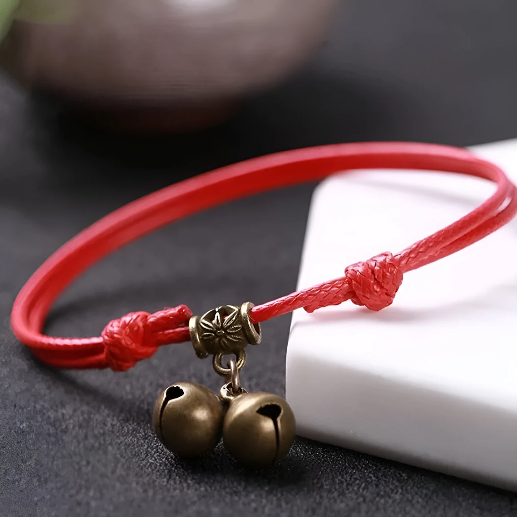 Nylon rope dog collar with brass bell shown in black, red, and coffee colour options on a plain background.