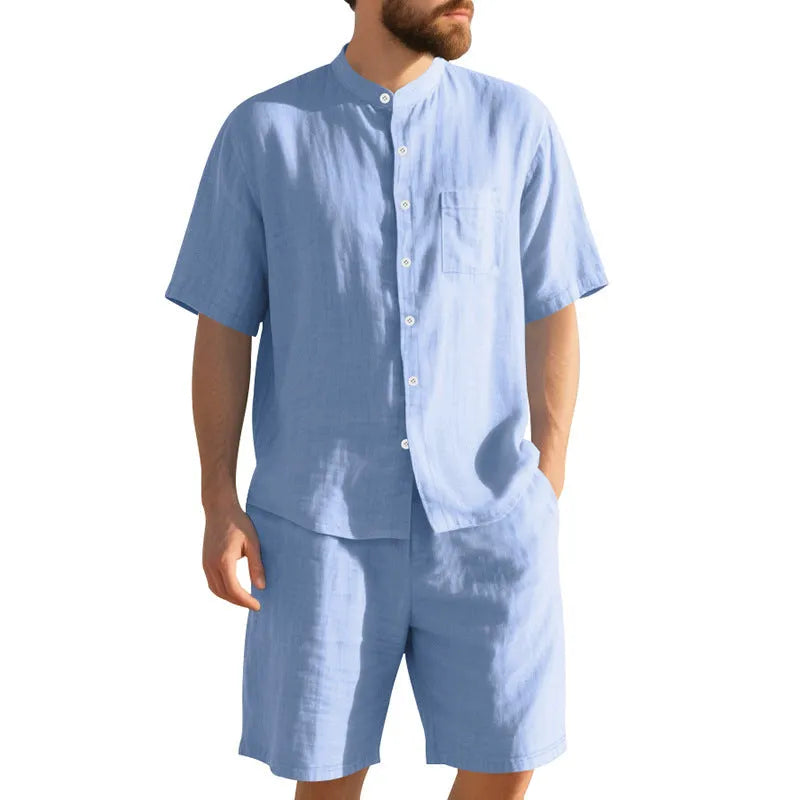 Men's light blue linen blend summer suit with henry collar shirt and shorts on a hanger.