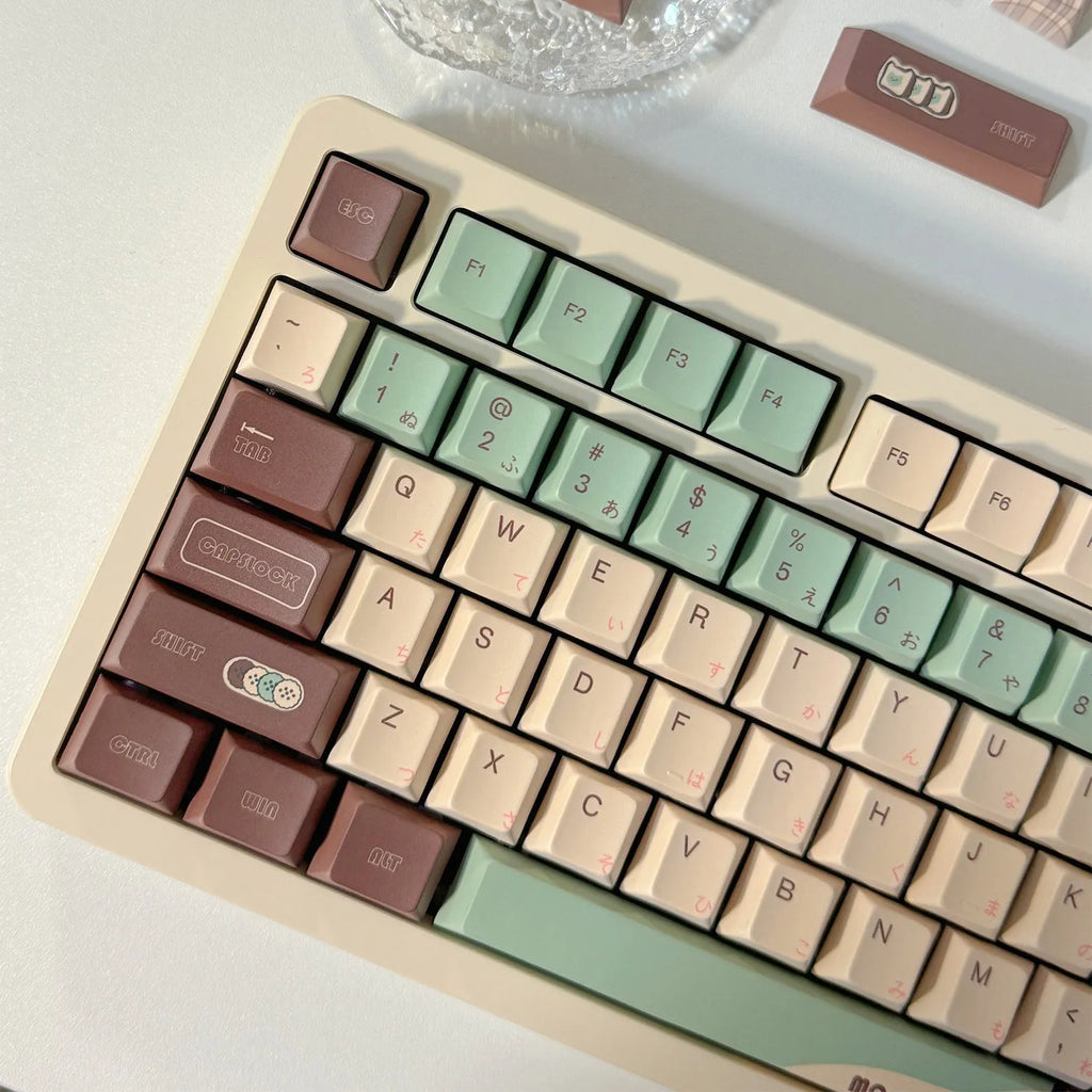 Matcha green themed ergonomic plastic wrist rest for mechanical keyboards with keycap puller.