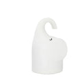 DOMI elephant-shaped silicone night light with warm white glow on a bedside table.