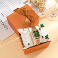 Women's gold green square watch with four matching bracelets in gift set packaging