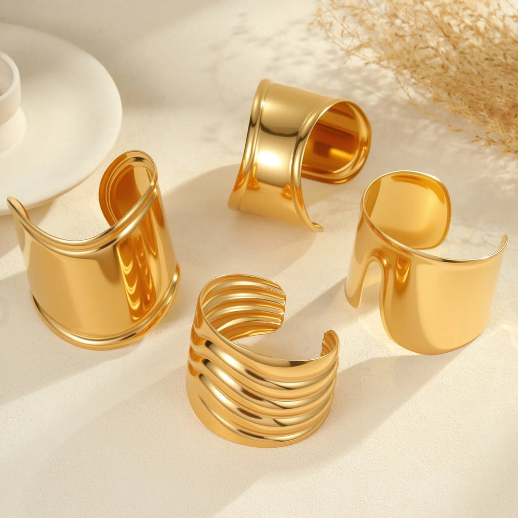 Women's fashion bracelet with exaggerated width, geometric wave patterns, and gold plating
