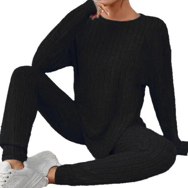 Black sunken stripe two-piece lounge set for women, showing top and pants.