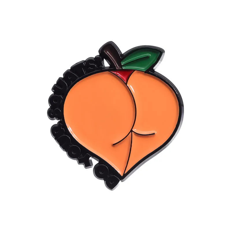 Colourful cartoon fruit design zinc alloy brooch pin on a fabric background.