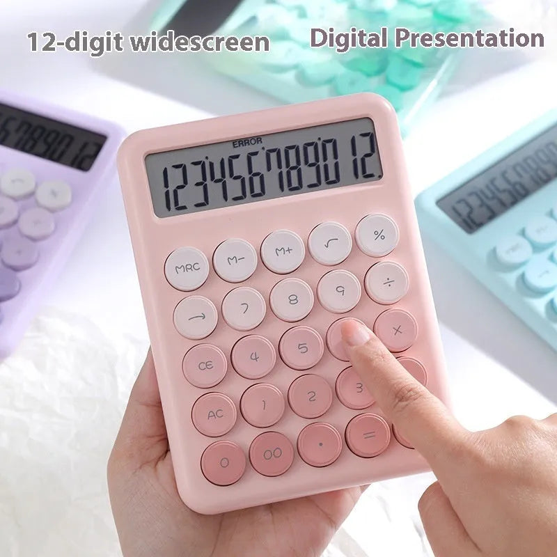 Gradient colour desk calculator in violet, cherry blossom pink, glacier blue, and mint green on a white desk.