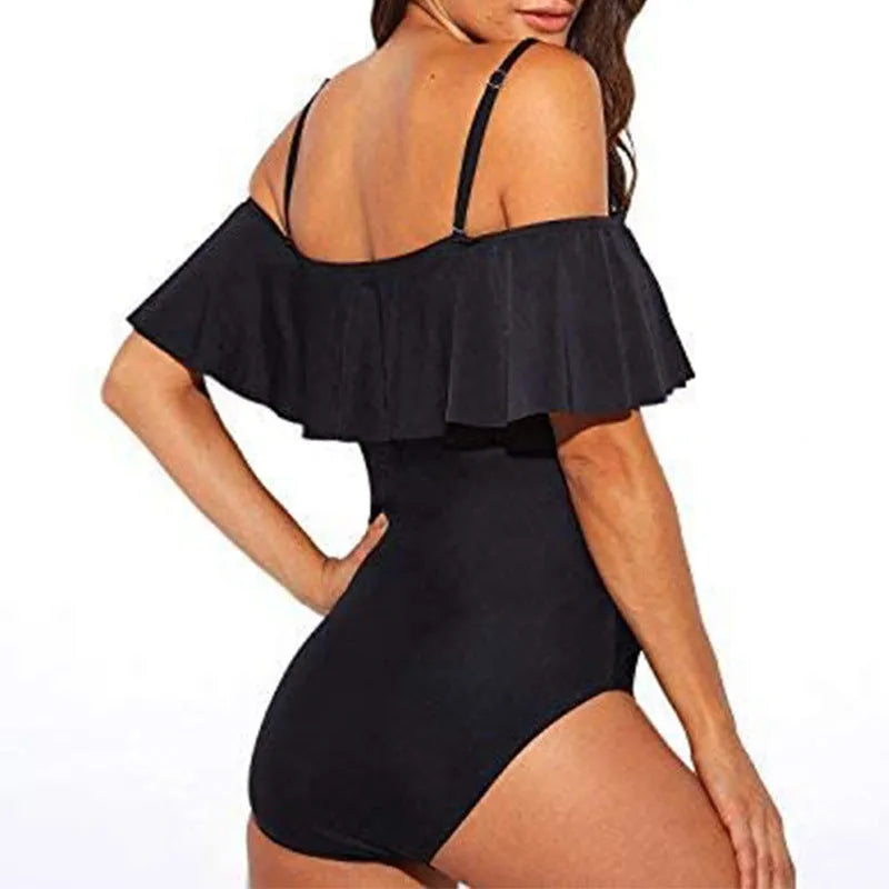 Black one-piece swimsuit with ruffled tube top straps and a cut-out design.