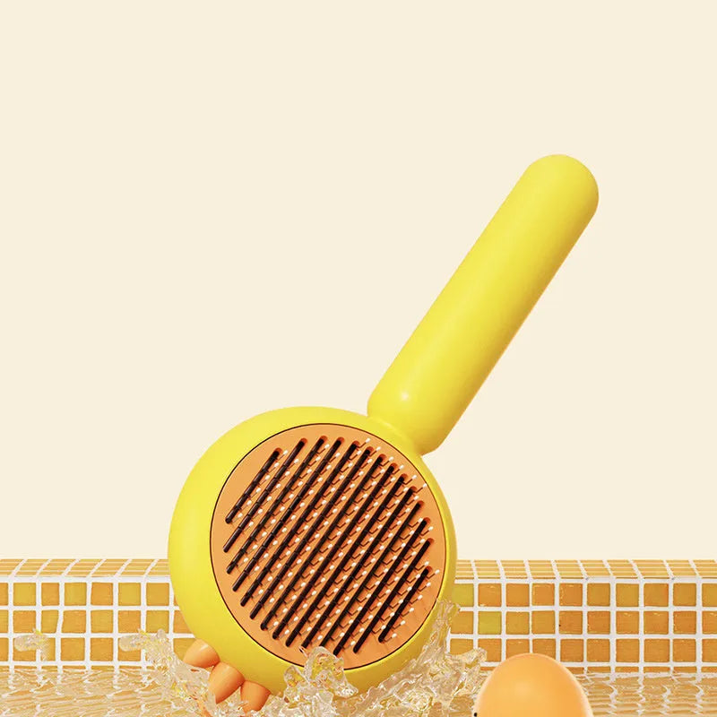 Purple pet grooming brush with self-cleaning button and stainless steel bristles for cats and dogs