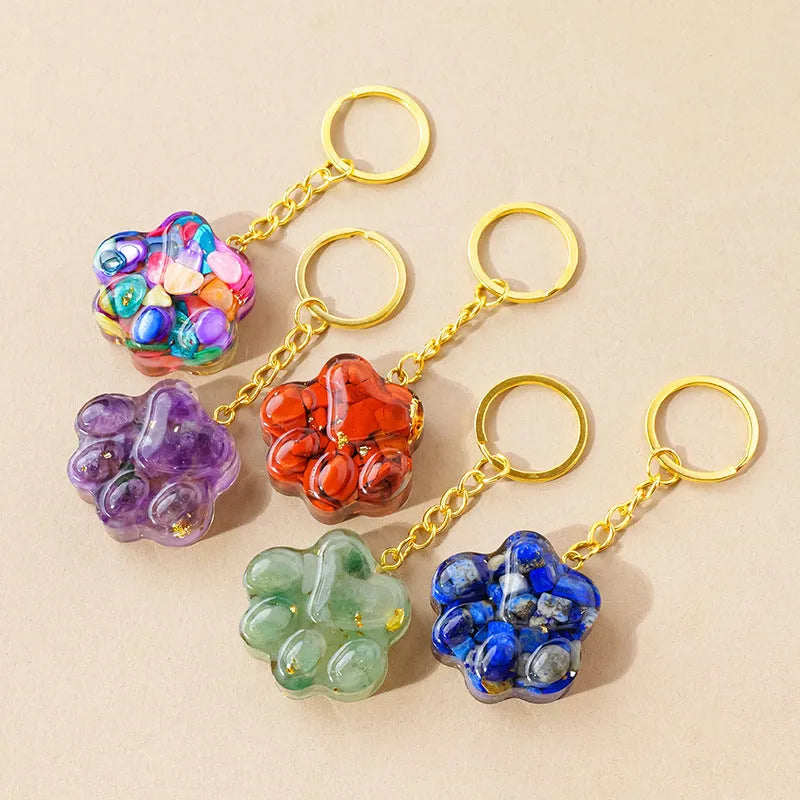 Small natural crystal cat's paw pendant on a metal keyring, available in various stone colours.