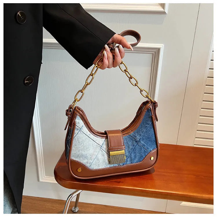 Brown denim women's shoulder bag with chain straps and bucket design showing phone compartment