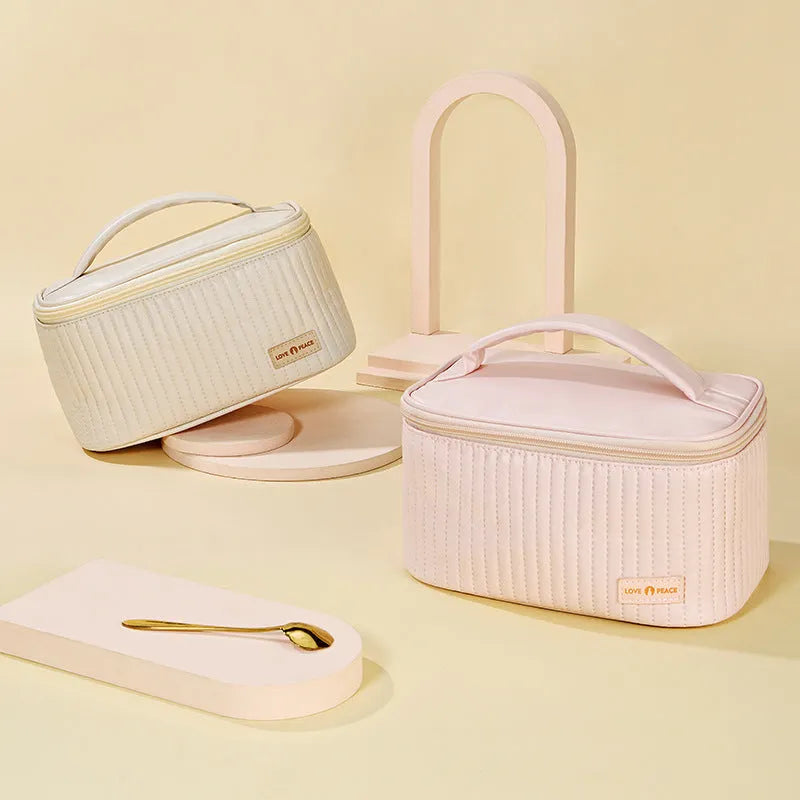 Open-top women's makeup bag in PU leather, shown in a choice of solid colours including pink, beige, and light blue.