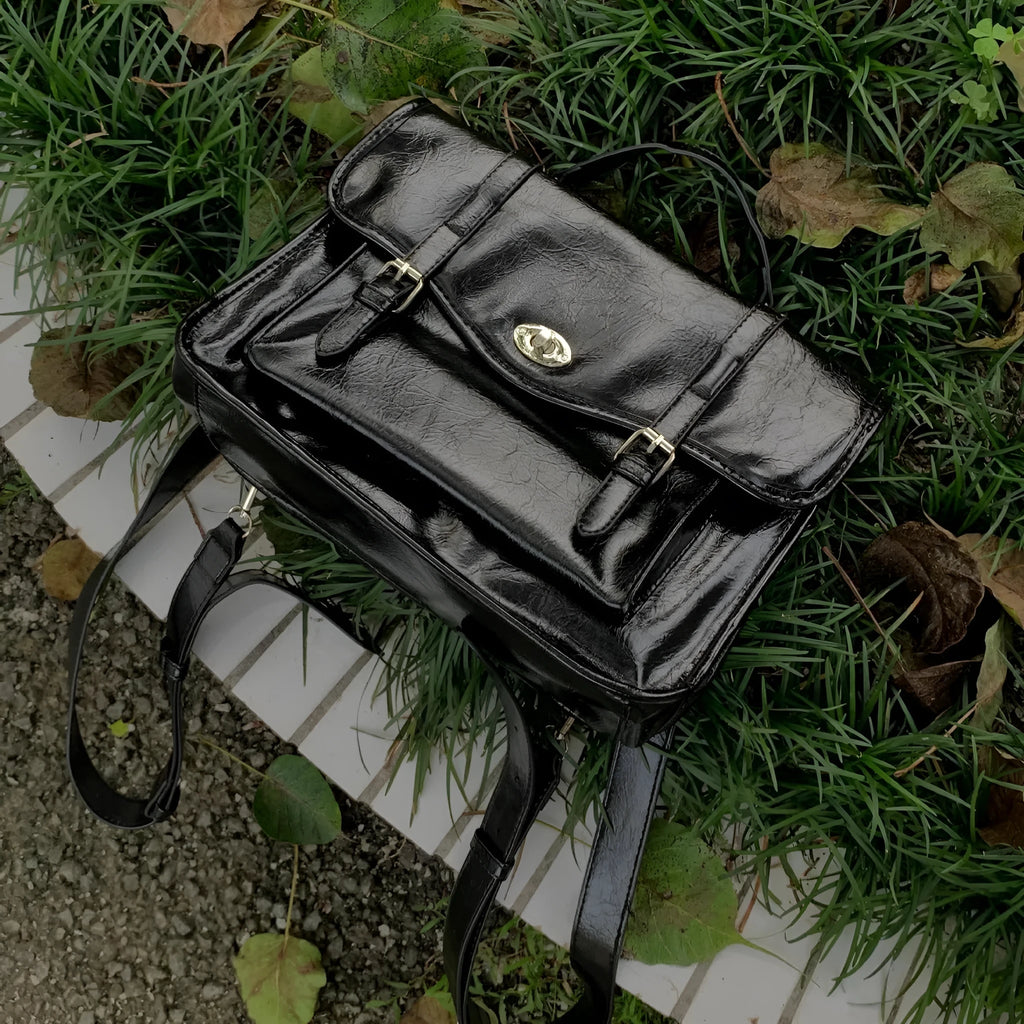 Black oil wax PU leather college style messenger bag for women with crossbody design