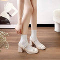 Women's black patent leather chunky heel round toe shoes for wide feet.