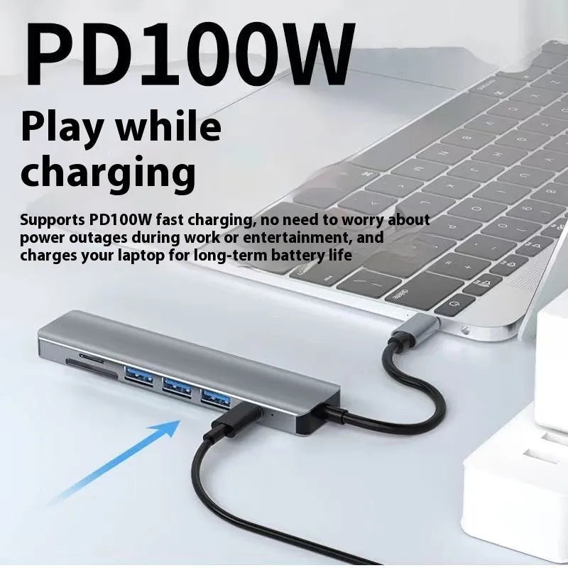 USB-C 7-in-1 expansion dock with HDMI port, multiple USB ports, and a 15cm black cable.