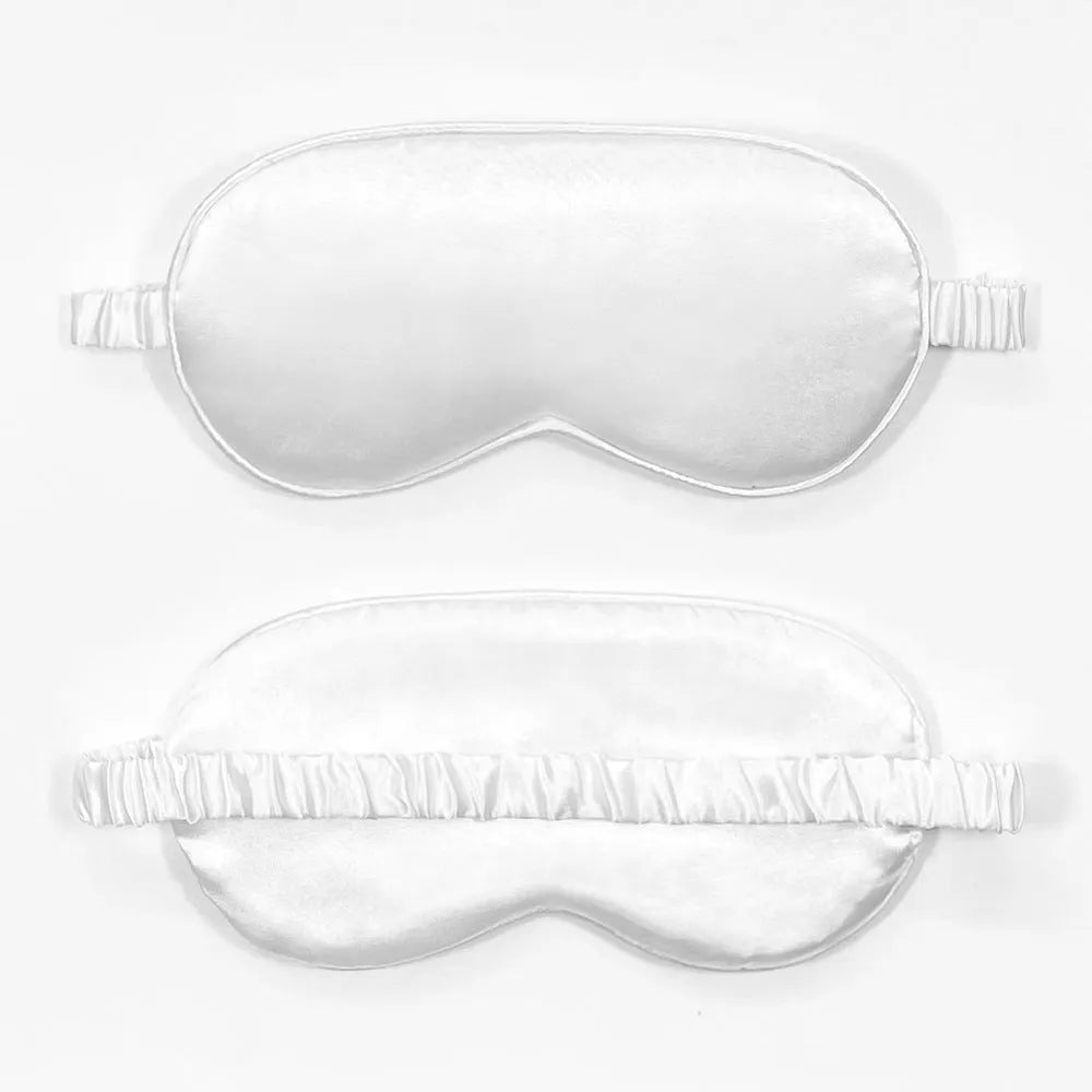 Double-sided silk-like sleep mask in rayon satin, shown in multiple colour options on a white background.