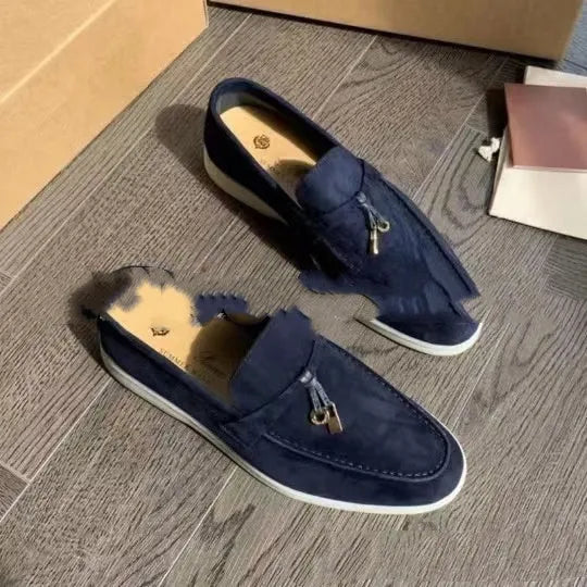 Unisex black slip-on casual loafers with rubber sole and round toe cap on a white background