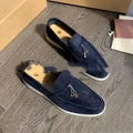 Unisex black slip-on casual loafers with rubber sole and round toe cap on a white background