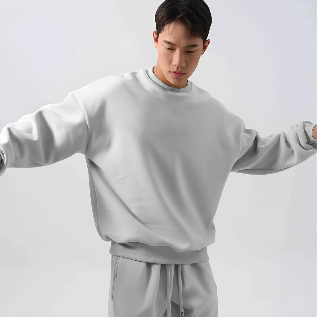 Men's polar fleece sports suit set showing crew neck top with long sleeves and matching padded trousers in winter colours