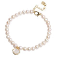 Close-up of a women's freshwater pearl bracelet with pearls arranged in a fan shape on a wrist.