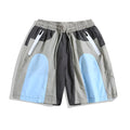 Blue patchwork men's beach shorts with elastic waist and above-knee length for outdoor sports