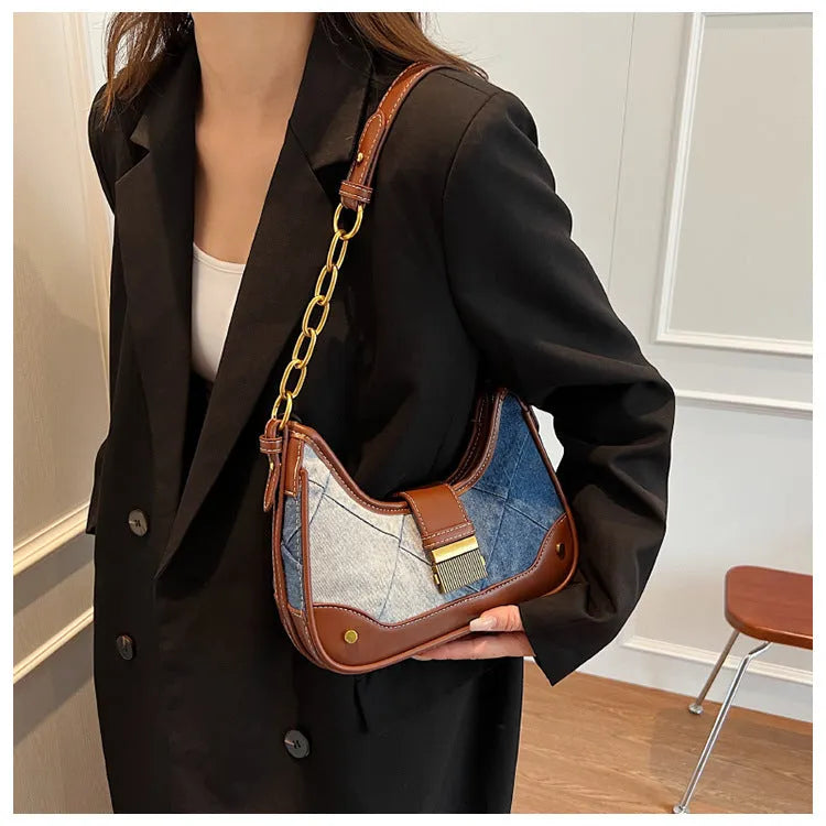 Brown denim women's shoulder bag with chain straps and bucket design showing phone compartment