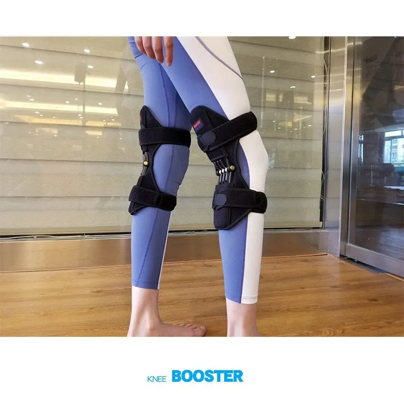 Black adjustable knee brace with patella support and visible booster spring mechanism for sports.