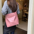 Pink corduroy one-strap shoulder bag with PU lining, showing its 39cm length.