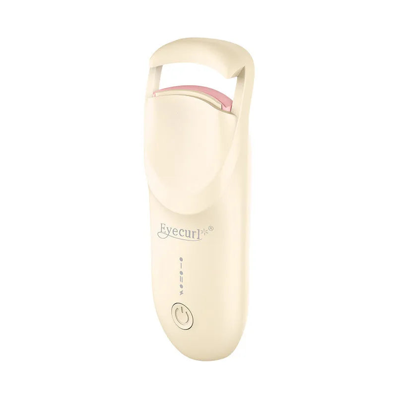 USB electric eyelash curler in cream white, pink, or apricot with charging cable.