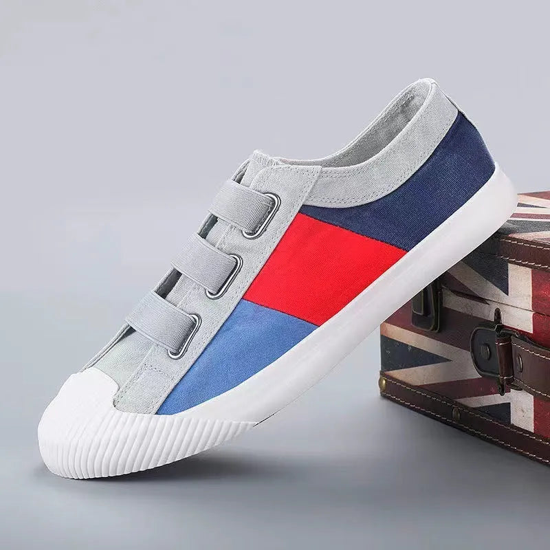 Men's low-top canvas sneakers in beige with colour stitching and an elastic band closure.