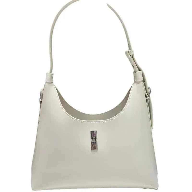 Soft genuine leather dumpling-shaped crossbody shoulder bag in a street style with lock detail