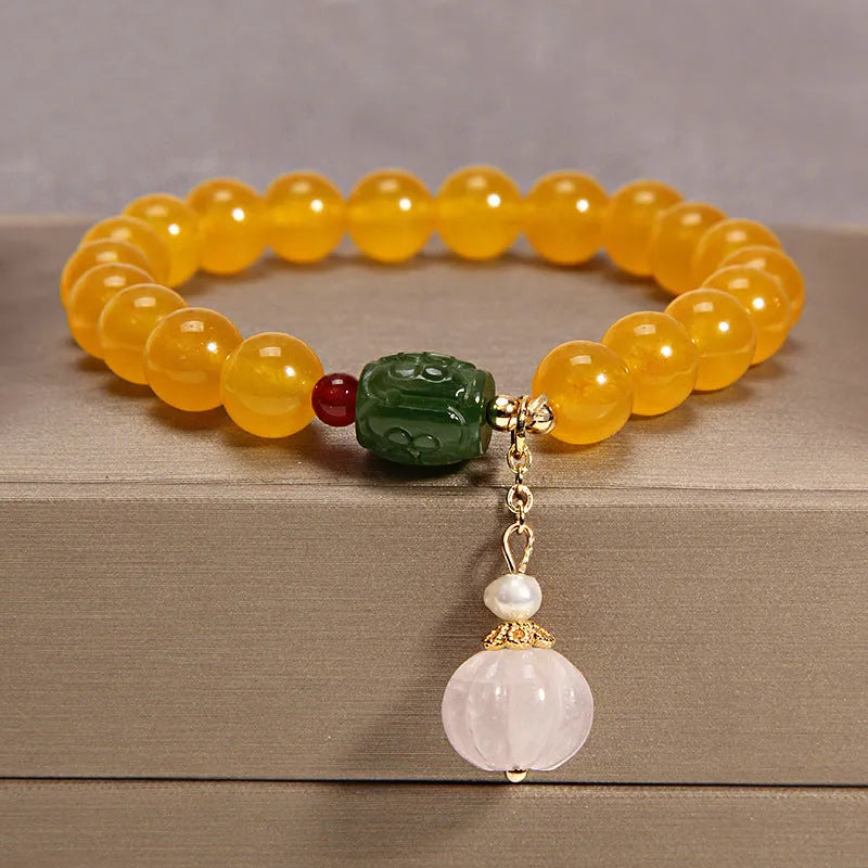 Khaki yellow agate crystal bracelet for women with gold silk threading.