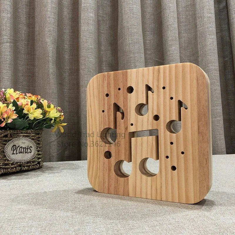 Square pine wood USB LED atmosphere lamp emitting warm white light.