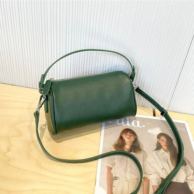 Cylindrical leather crossbody phone bag in vegetable tanned genuine leather with sewing thread detailing