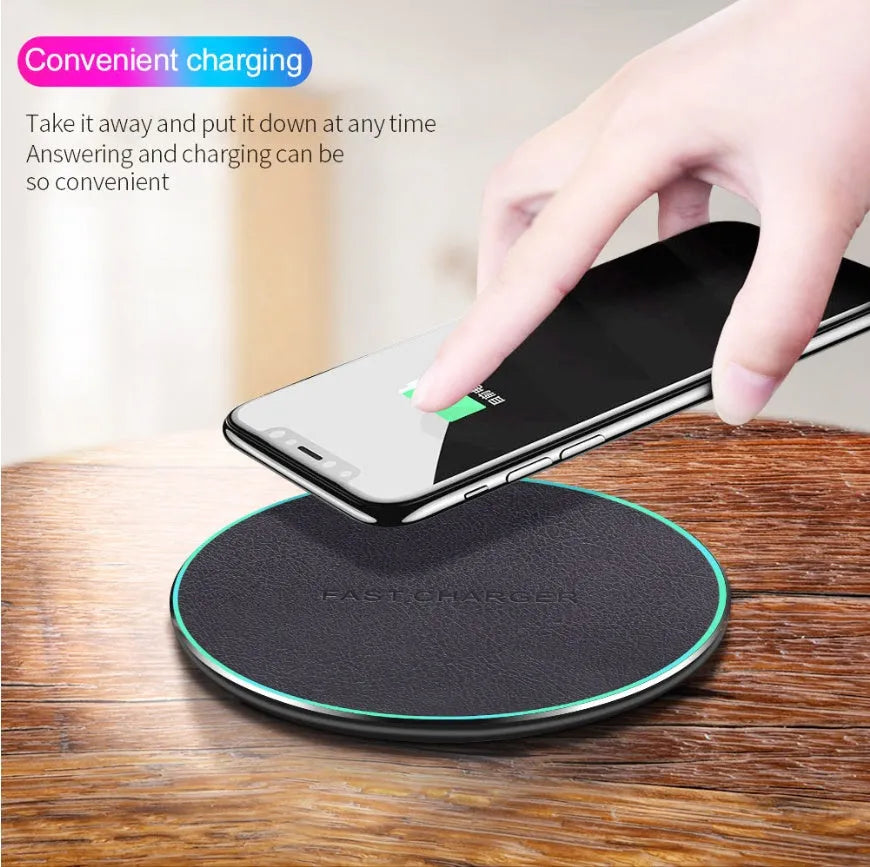 Black circular wireless charging pad for iPhone 11 with LED indicator light