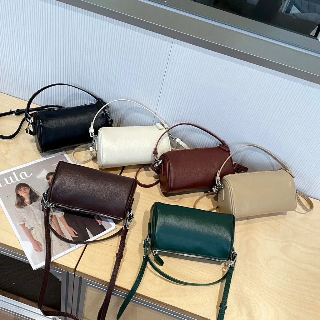 Cylindrical leather crossbody phone bag in vegetable tanned genuine leather with sewing thread detailing