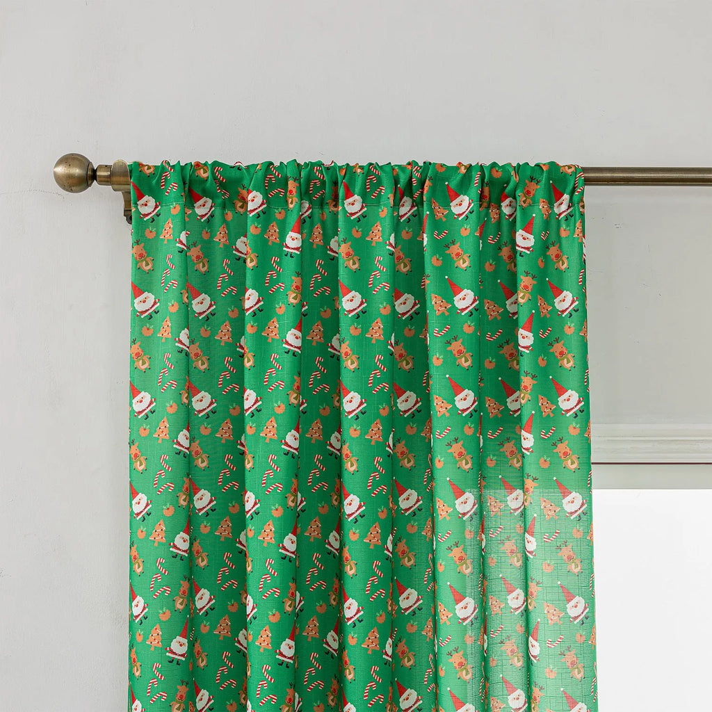 Green Christmas curtain with printed snowman and angel cartoon figures pattern