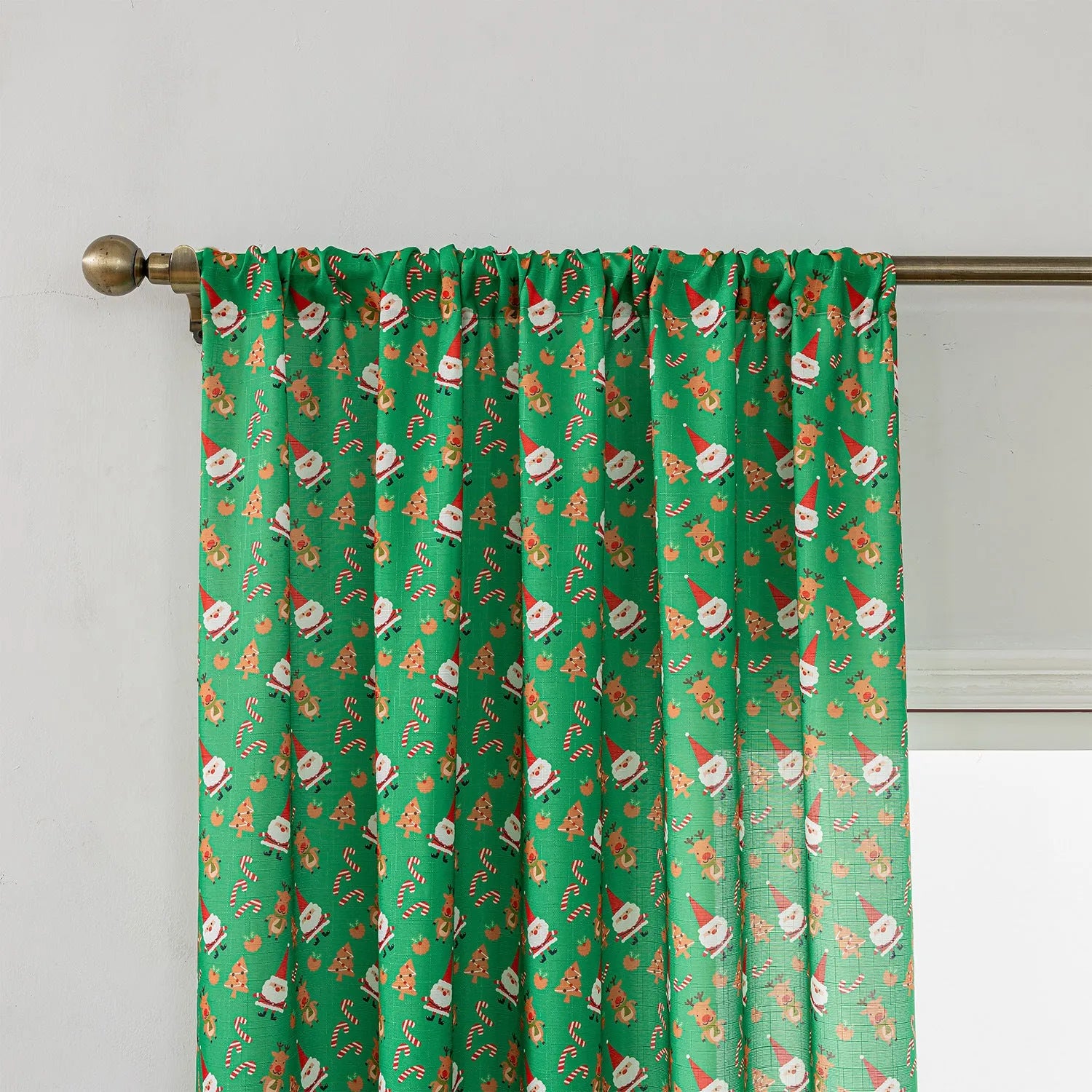 Green Christmas curtain with printed snowman and angel cartoon figures pattern
