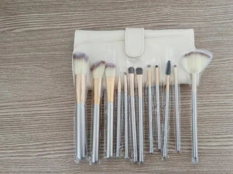 Persian makeup brush set with champagne handles and white bristles arranged in 12, 18, and 24 brush options.