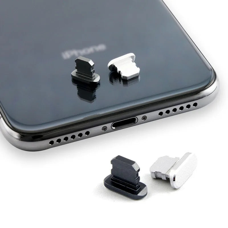 Aluminium alloy iPhone charging port dust plug in multiple colours including gold, silver, blue, red, grey, black, and rose gold.