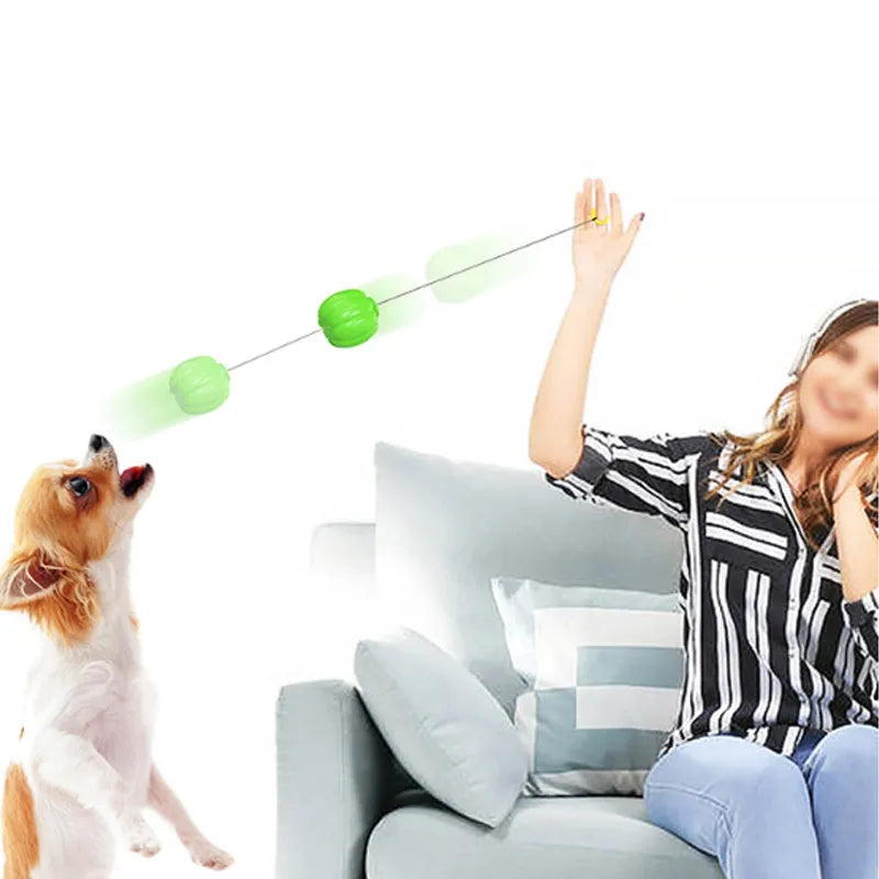 Green, orange, and yellow plastic pumpkin-shaped dog chew toy with squeaker.