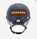 Cycling helmet with red LED brake light on the back, shown in M and L sizes.
