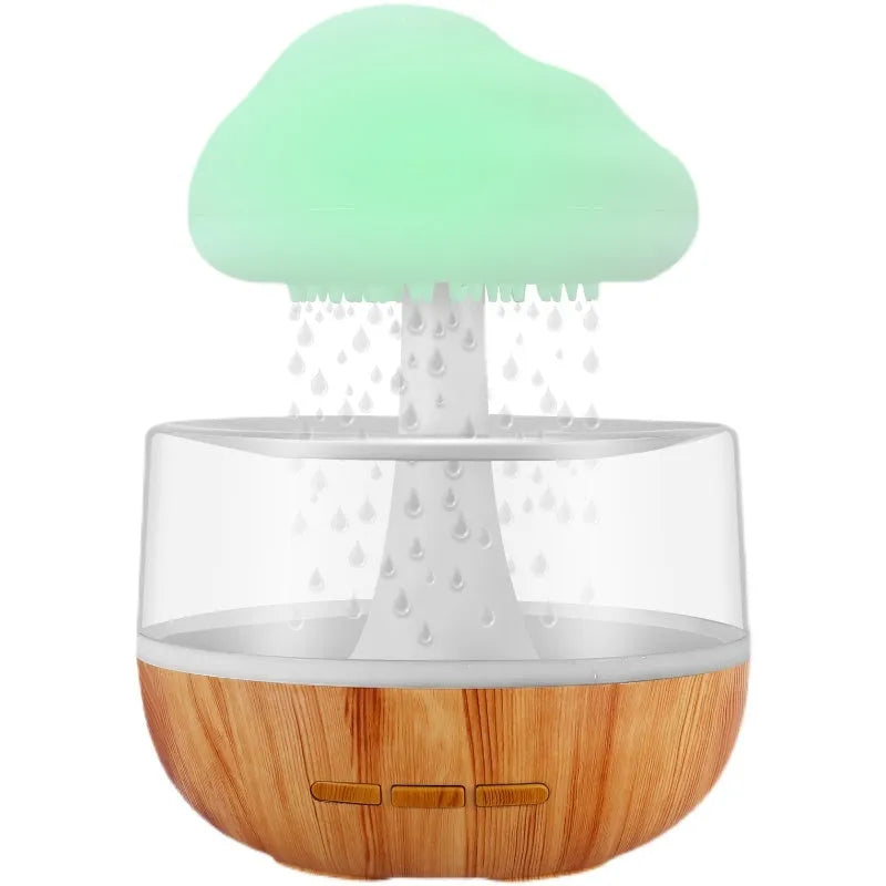 White cloud-shaped humidifier with night light and water flow display on wooden surface