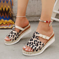 Women's leopard print wedge platform sandals with fish mouth open toe on a rubber sole, shown in beige.