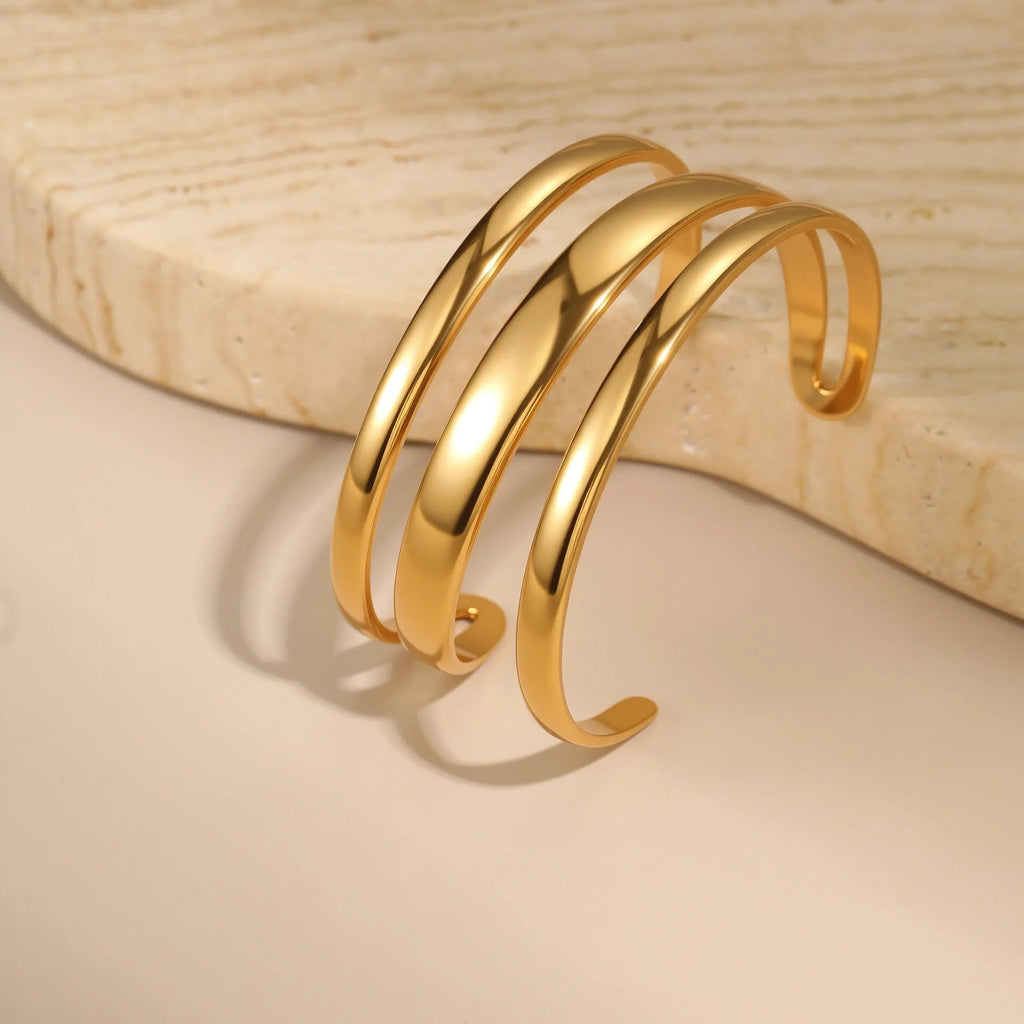 Women's stainless steel bracelet with geometric line design and 18K gold electroplating