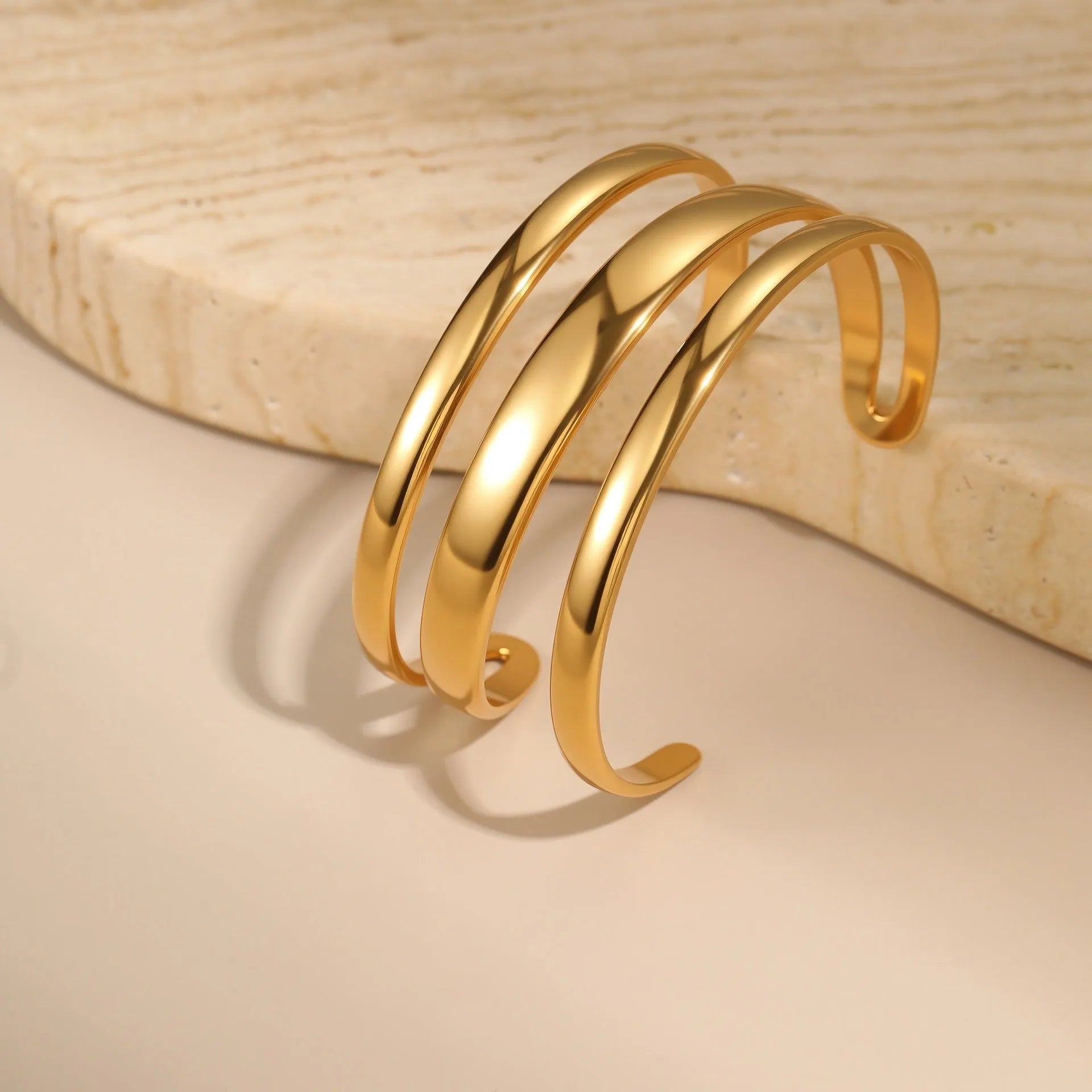 Women's stainless steel bracelet with geometric line design and 18K gold electroplating