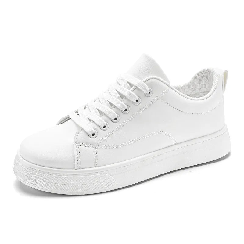 Men's low-top Korean-style casual sneakers in black on white colour with round toe and flat rubber sole.